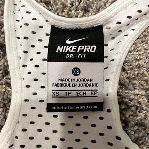 Nike women’s dri-fit sport top. White with black swoosh